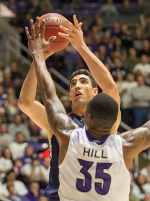 Rick Egan  |  The Salt Lake Tribune

Brigham Young Cougars center Corbin Kaufusi (44) shoots over Weber State Wildcats forward Kyndahl Hill (35), in basketball action BYU vs Weber State, at the Dee Events Center in Ogden, Saturday, December 13, 2014