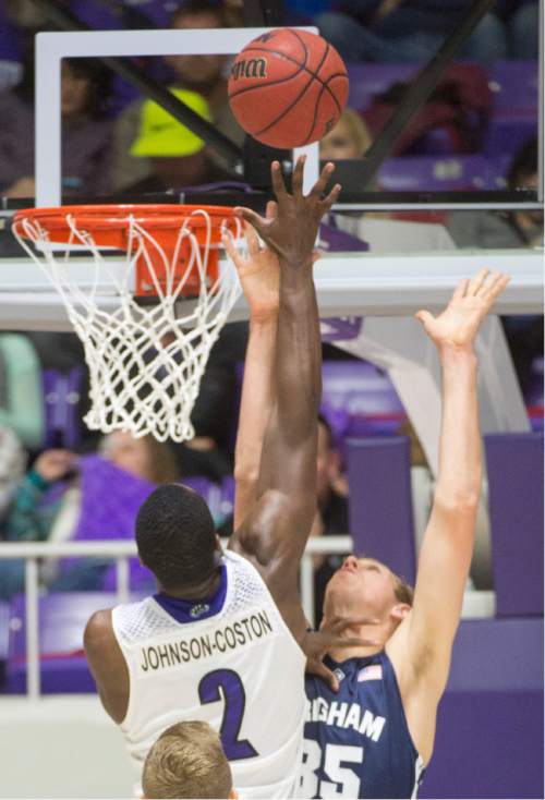 Rick Egan  |  The Salt Lake Tribune

Weber State Wildcats forward Jaylen Johnson-Coston (2) shoots over 
Brigham Young Cougars forward Isaac Neilson (35), in basketball action BYU vs Weber State, at the Dee Events Center in Ogden, Saturday, December 13, 2014