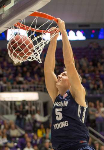 Rick Egan  |  The Salt Lake Tribune

Brigham Young Cougars guard Kyle Collinsworth (5) dunks the ball,  in basketball action BYU vs Weber State, at the Dee Events Center in Ogden, Saturday, December 13, 2014