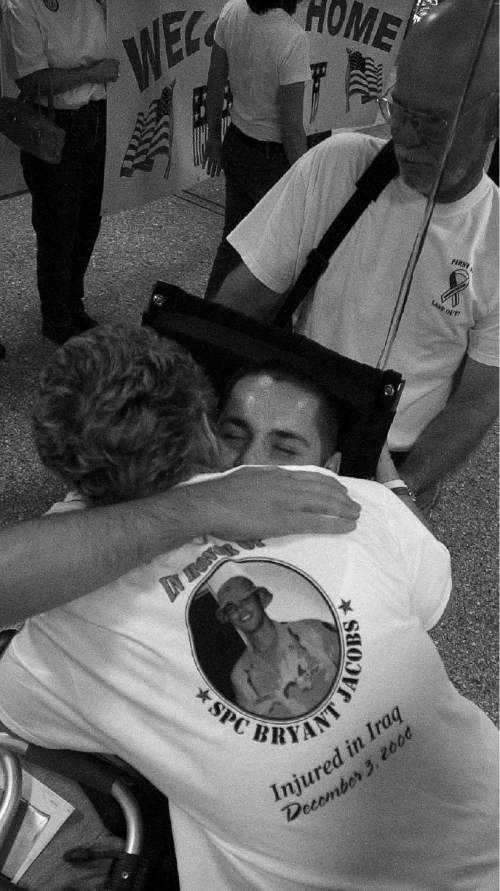 Paul Fraughton  |  The Salt Lake Tribune
Spc Bryant Jacobs is hugged by his grandmother Sharon Lloyd as he is welcomed home by family and friends at Salt lake International Airport, Friday, June 10, 2005.