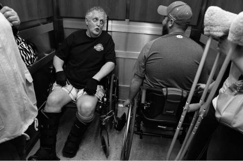 Scott Sommerdorf   |  The Salt Lake Tribune
Anotehr veteran ____name to come_____ talks with Bryant Jacobs during an elevator ride as Jacobs visits the VA to get a physical therapy assessment, Wednesday, March 26, 2014.