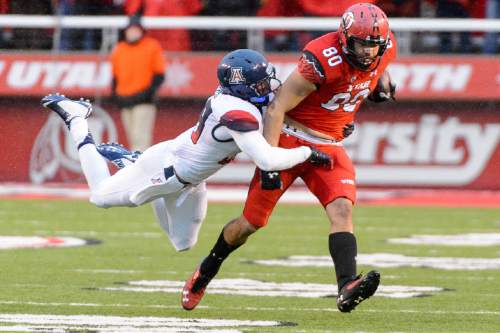 Trent Nelson  |  The Salt Lake Tribune
Arizona Wildcats safety Jared Tevis (38) dives to stop Utah Utes tight end Westlee Tonga (80) as the University of Utah Utes hosts the Arizona Wildcats, college football at Rice-Eccles Stadium in Salt Lake City Saturday November 22, 2014.