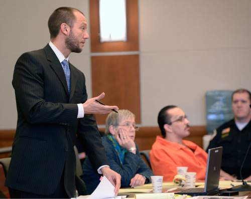 Al Hartmann  |  The Salt Lake Tribune 
Matthew Barraza, defense lawyer for David Fresques, questions witness in Judge Mark Kouris' court in West Jordan Thursday February 6. Fresques is charged with aggravated murder for allegedly killing three people at a Midvale home in February 2013.