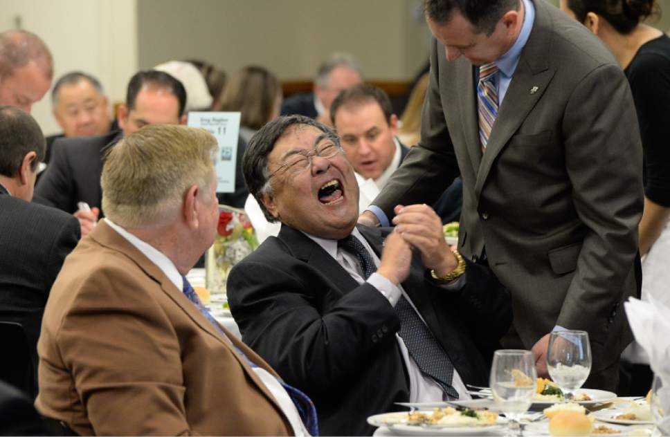 Francisco Kjolseth  |  The Salt Lake Tribune
Greg Hughes, right, newly elected speaker of the House, gets a laugh out of Salt Lake County Councilman Randy Horiuchi who is retiring and was being honored during a luncheon on Wednesday, Dec. 17, 2014.
