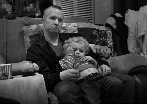 Scott Sommerdorf   |  The Salt Lake Tribune
Dustin Marble sits holding his energetic son Zander as he talks with Bryant Jacobs about when they both were considering enlisting in the Army. He and Jacobs had just played in a horseshoe tournament in Herriman, Saturday, March 1, 2014.