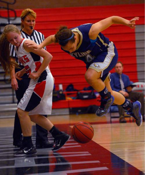 Leah Hogsten  |  The Salt Lake Tribune
Alta's McCall Sieverts and Skyline's Hillary Weixler chase the ball out of bounds. Alta High School girls basketball team defeated Skyline High School,  47-41, Tuesday, December 16, 2014 at Alta.