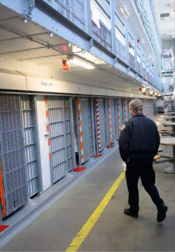 Al Hartmann  |  Tribune file photo 
Utah Department of Corrections officer walks through the medium security Wasatch A block at the Utah State Prison in Draper. West Jordan looks like it's off the list of relocation sites, which has been narrowed down to four sites.