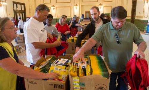 Rick Egan  |  The Salt Lake Tribune

Volunteers help fill 8,500 backpacks with school supplies for low-income kids in the Grand Hall at the Gateway, during United Way of Salt Lake's 22nd annual Day of Caring, Thursday, September 11, 2014. 
More than 5,500 volunteers from over 125 companies participated in 130 service projects throughout  Davis, Salt Lake, Summit and Tooele counties today.