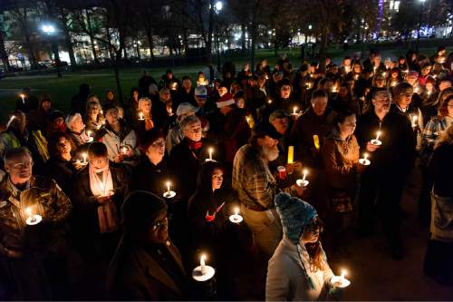 Trent Nelson  |  The Salt Lake Tribune
Candles are lit at a vigil in Pioneer Park, Salt Lake City, Thursday December 18, 2014, honoring Utahns who died on the streets while homeless in 2014.