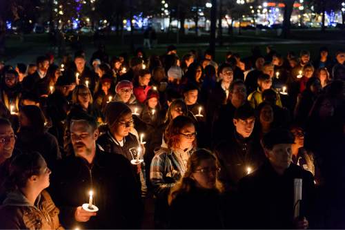 Trent Nelson  |  The Salt Lake Tribune
Candles are lit at a vigil in Pioneer Park, Salt Lake City, Thursday December 18, 2014, honoring Utahns who died on the streets while homeless in 2014.