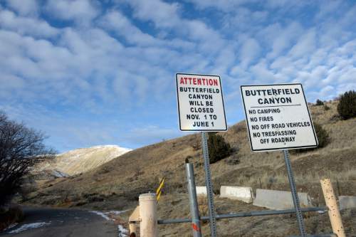 Al Hartmann  |  The Salt Lake Tribune
Barrier and signs blocks the entrance to Butterfield Canyon Road at about 13100 South and 9000 West.  The right side of the road is Kennecott property and left side is BLM land both are posted no trespassing.  A toll road or tunnel up Butterfield Canyon and down Middle Canyon on the other side of Oquirrh Mountains has been proposed as an improved shortcut between Tooele and southwest Salt Lake County.