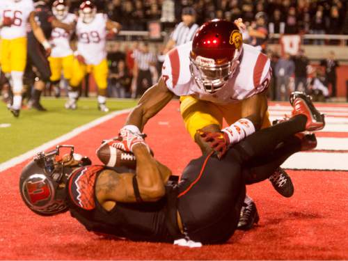 Rick Egan  |  The Salt Lake Tribune
 
USC Trojans safety Elijah Steen (24) jumps on Ute wide receiver Kaelin Clay (8) as he holds onto the pass that gave the Utes a 24-21 victory over the USC Trojans at Rice-Eccles Stadium, Saturday, October 25, 2014.