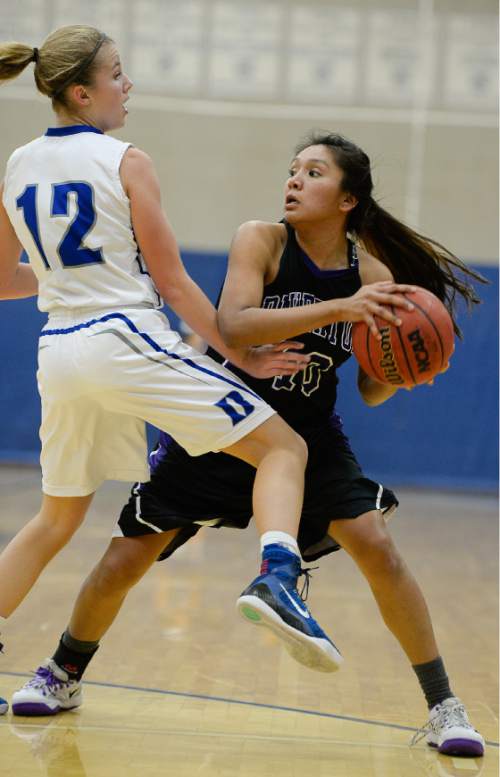 Francisco Kjolseth  |  The Salt Lake Tribune
Bingham's Jade Campbell put on the pressure as Riverton's  Tia Yazzie tries to find an opening in game action at Bingham in South Jordan on Thursday night, Dec. 18, 2014.