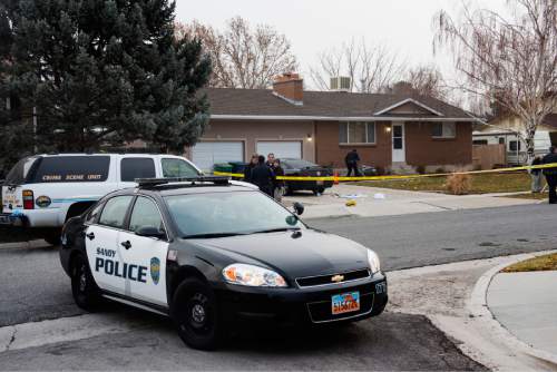 Rick Egan  |  The Salt Lake Tribune
Sandy Police investigate a shooting at 343 Gary Avenue in Sandy on Thursday.