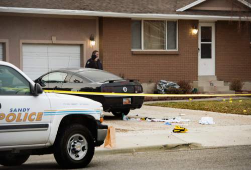 Rick Egan  |  The Salt Lake Tribune

Sandy Police investigate a shooting at 343 Gary Avenue in Sandy, Thursday, December 18, 2014