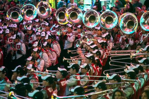 Chris Detrick  |  The Salt Lake Tribune
Members of the Marching Utes band and Utah fans perform during the Fremont Street Experience Pep Rally in Las Vegas Friday December 19, 2014.