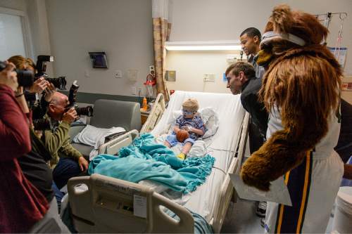 Trent Nelson  |  The Salt Lake Tribune
Utah Jazz players Gordon Hayward, Trey Burke and Bear pose for a photo with Jaxon Jensen during a visit by Jazz players to Primary Childrenís Medical Center in Salt Lake City last week.