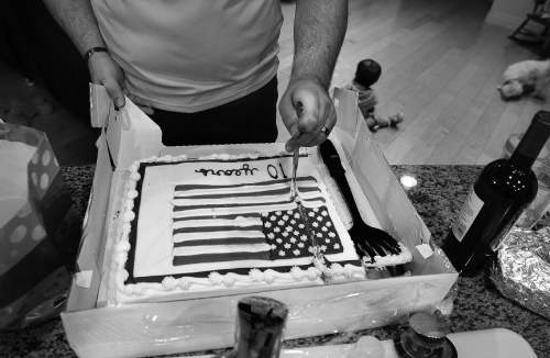 Scott Sommerdorf   |  The Salt Lake Tribune

Bryant Jacobs cuts his 10th anniversary cake as he  celebrates his "Alive Day" - the 10th anniversary of his injury suffered as a result of an IED blast in Iraq. He celebrated with friends and family in his home, Wednesday, December 3, 2014.