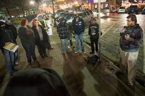 Rick Egan  |  The Salt Lake Tribune

Craig Bowden (right) talks to a dozen or so people against police violence, in front of the Federal Building in Ogden,  Saturday, December 20, 2014