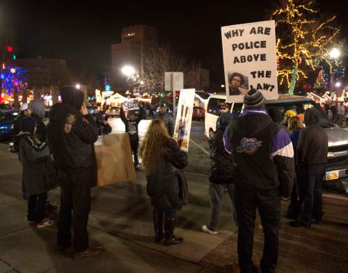Rick Egan  |  The Salt Lake Tribune

Malik Dayo talks to a dozen or so people against police violence, in front of the Federal Building in Ogden,  Saturday, December 20, 2014