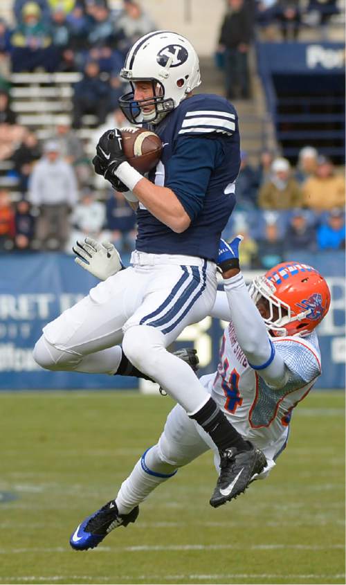 Leah Hogsten  |  The Salt Lake Tribune
Brigham Young Cougars wide receiver Mitch Mathews (10) catches a 71-yd pass and slips past Savannah State Tigers wide receiver Dylan Cook (84) for the first touchdown of the game. Brigham Young University leads Savannah State 51-0 at the half, November 22, 2014, at LaVell Edwards Stadium in Provo.