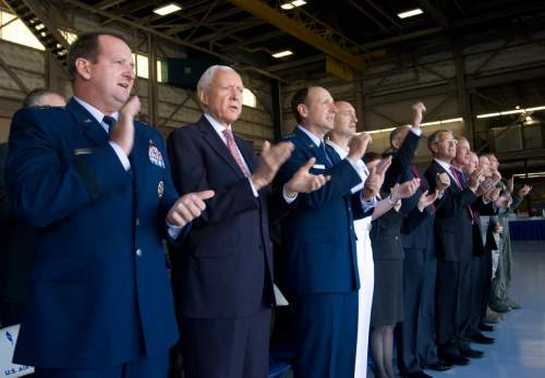 Rick Egan  | The Salt Lake Tribune 

Maj. Gen. Brent H. Baker Sr., Ogden Air Logistics Complex commander (left) Sen. Orrin Hatch, Lt. Gen. Bruce Litchfield, Air Force Sustainment Center commander and Rear Adm. Randolph Mahr, DoD F-35 Deputy Program Director; sing along to the Air Force song, at a presentation where dignitaries and workers at Hill Air Force base got their first look at the the F-35A Joint Strike Fighter, Friday, September 20, 2013.