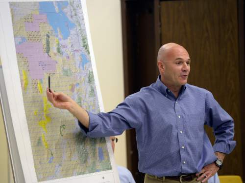 Al Hartmann  |  The Salt Lake Tribune
Lt. Col. Chris Robinson a U.S. Air Force representative discusses map of expansion of the Utah Test and Training Range during a presentation at a public forum Monday October 20 at West Desert High School in Partoun.