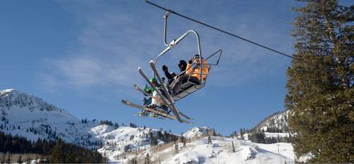 Al Hartmann  |  The Salt Lake Tribune
Skiers ride the Majestic lift at Brighton Ski Resort under a bright blue sky with fresh snow Tuesday Dec. 23.  The holiday ski season really got underway with school out and new snow from the weekend storms.
