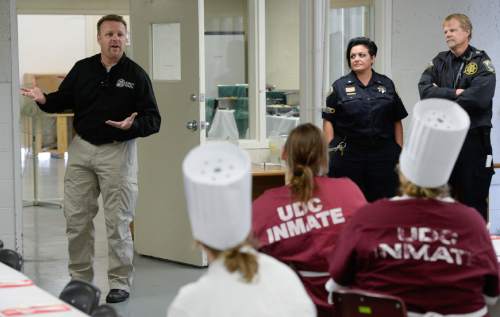 Francisco Kjolseth  |  The Salt Lake Tribune
Captain Jeff Wilson, head of education and vocational life skills at the Utah State Prison, offers words of encouragement to the culinary students.