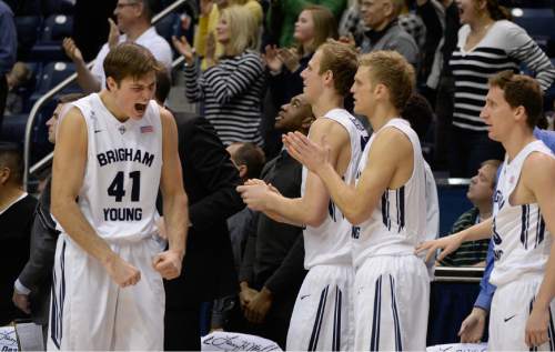Francisco Kjolseth  |  The Salt Lake Tribune
BYU's Luke Worthington, left, gets pumped up as the team makes improvements in the final minutes against UMass at the Marriott Center in Provo on Tuesday, Dec. 23, 2014.
