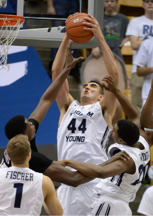 Francisco Kjolseth  |  The Salt Lake Tribune
BYU's Corbin Kaufusi faces a crowded field while battling UMass at the Marriott Center in Provo on Tuesday, Dec. 23, 2014.