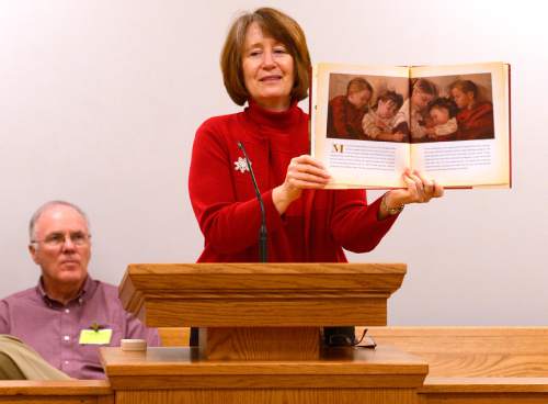 Leah Hogsten  |  The Salt Lake Tribune
Kathy Kay shows artwork from "A Christmas Dress for Ellen." On Christmas Day, 2nd District Court Judge Thomas Kay and his wife Kathy read a Christmas story and poems Judge Kay has written to Davis County Jail inmates. Thursday, December 25, 2014 in Farmington, Utah.