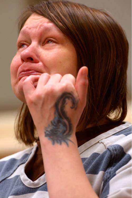 Leah Hogsten  |  The Salt Lake Tribune
Marcella Ginn is overcome with emotion as she listens to Judge Thomas Kay read his poems written about the birth of Jesus. On Christmas Day, 2nd District Court Judge Thomas Kay and his wife Kathy read a Christmas story and poems Judge Kay has written to Davis County Jail inmates. Thursday, December 25, 2014 in Farmington, Utah.