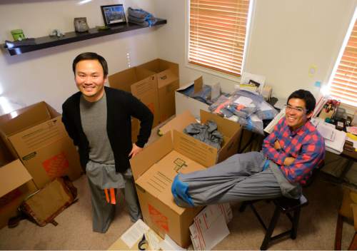 Steve Griffin  |  The Salt Lake Tribune

University of Utah students Garred Lentz and Brayden Iwasaki wear their "Sakpants"  which are like footie sweatpants for grownups and kids. They have received about 1,000 orders for their first run of the pants. They are photographed here in their makeshift warehouse at Brayden Iwasaki's house in Holladay, Utah Wednesday, December 10, 2014.