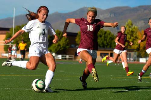 Chris Detrick  |  The Salt Lake Tribune
Woods Cross' Kennedy Yost (7) and Maple Mountain's Kaitlyn Bailey (16) go for the ball during the game at Woods Cross High School Tuesday October 14, 2014.