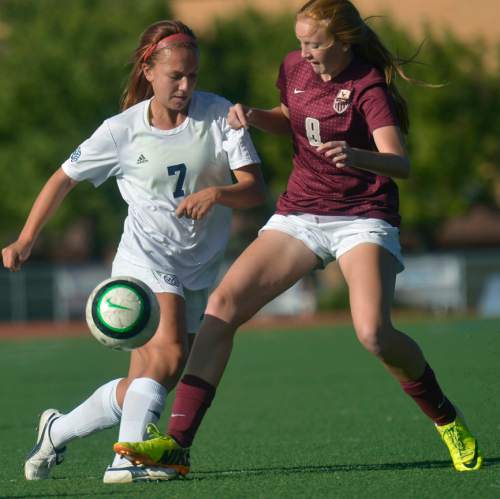 Chris Detrick  |  The Salt Lake Tribune
Woods Cross' Kennedy Yost (7) and Maple Mountain's Lauren Swindlehurst (8) go for the ball during the game at Woods Cross High School Tuesday October 14, 2014.