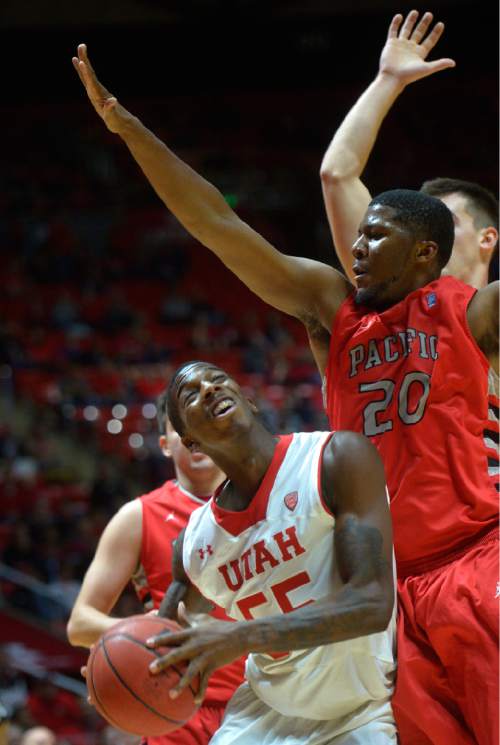 Chris Detrick  |  The Salt Lake Tribune
Utah Utes guard Delon Wright (55) is guarded by Pacific Boxers DeVon Pouncey (20) during the game at the Huntsman Center Thursday November 6, 2014.