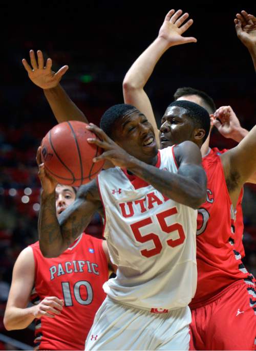 Chris Detrick  |  The Salt Lake Tribune
Utah Utes guard Delon Wright (55) is guarded by Pacific Boxers DeVon Pouncey (20) during the game at the Huntsman Center Thursday November 6, 2014.