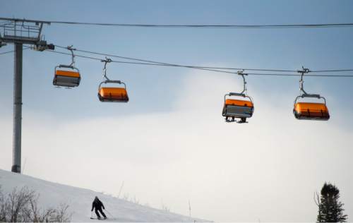 Rick Egan  |  The Salt Lake Tribune

A skier ski's under the Orange Bubblegum Express Lift at The Canyons Resort, Friday, December 26, 2014