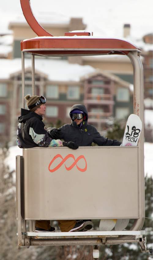 Rick Egan  |  The Salt Lake Tribune

Snow boarders  head back to their cars on the Cabriolet, after a day of skiing at the Canyons Resort, Friday, December 26, 2014