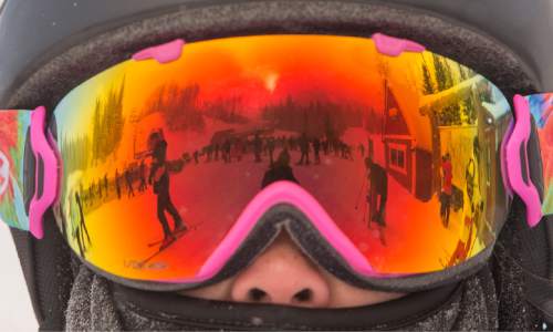 Rick Egan  |  The Salt Lake Tribune

Skies and snow boarders are reflected in the goggles worn by Thea Cavett, San Francisco, at The Canyons Resort, Friday, December 26, 2014