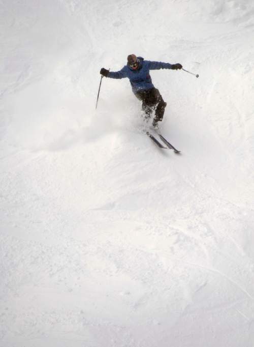 Rick Egan  |  The Salt Lake Tribune

A skier makes some turns under the Red Pine Gondola, at The Canyons Resort, Friday, December 26, 2014