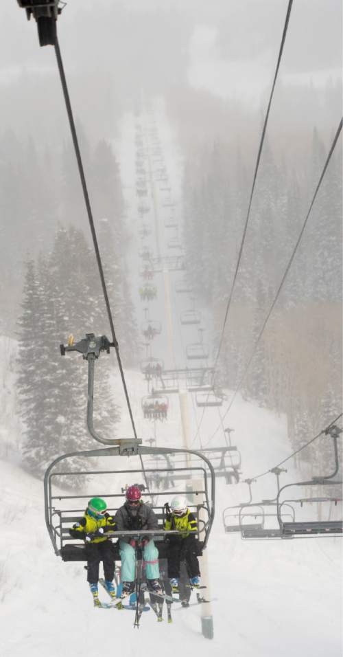 Rick Egan  |  The Salt Lake Tribune

Skiers ride the Saddleback Express express lift, at The Canyons Resort, Friday, December 26, 2014