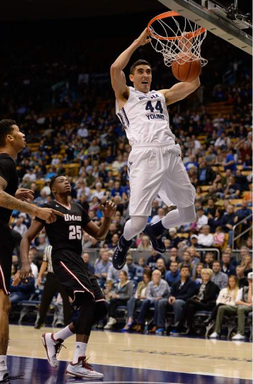 Francisco Kjolseth  |  The Salt Lake Tribune
BYU's Corbin Kaufusi slams the ball into the net over UMass in game action at the Marriott Center in Provo on Tuesday, Dec. 23, 2014.