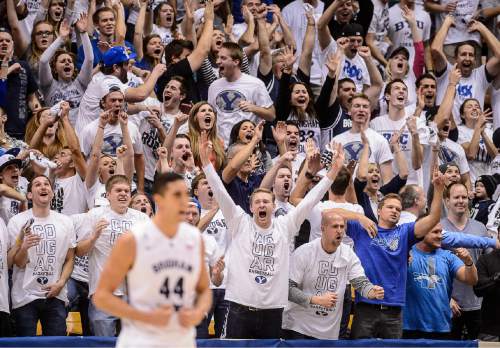 Trent Nelson  |  The Salt Lake Tribune
BYU fans celebrate a three-pointer by Brigham Young Cougars guard Kyle Collinsworth (5) to tie the game at the half, 43-43, as BYU hosts Gonzaga, men's college basketball at the Marriott Center in Provo, Saturday December 27, 2014.
