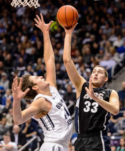 Trent Nelson  |  The Salt Lake Tribune
Gonzaga Bulldogs forward Kyle Wiltjer (33) shoots over Brigham Young Cougars forward Luke Worthington (41) as BYU hosts Gonzaga, men's college basketball at the Marriott Center in Provo, Saturday December 27, 2014.