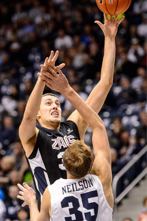 Trent Nelson  |  The Salt Lake Tribune
Gonzaga Bulldogs forward Kyle Wiltjer (33) shoots over Brigham Young Cougars forward Isaac Neilson (35) as BYU hosts Gonzaga, men's college basketball at the Marriott Center in Provo, Saturday December 27, 2014.