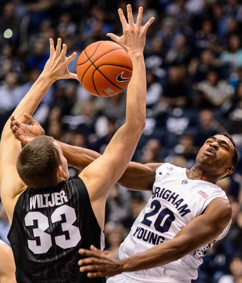 Trent Nelson  |  The Salt Lake Tribune
Gonzaga Bulldogs forward Kyle Wiltjer (33) knocks the ball away from Brigham Young Cougars guard Anson Winder (20) as BYU hosts Gonzaga, men's college basketball at the Marriott Center in Provo, Saturday December 27, 2014.