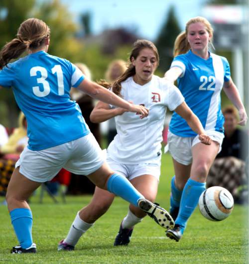 Steve Griffin  |  The Salt Lake Tribune


Davis High School soccer player Ireland Dunn cuts between Layton defenders Abby Roberts, left, and Shelby Baker during game against in Kaysville, Utah Tuesday, September 9, 2014.