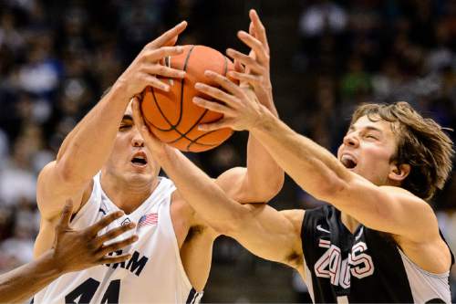 Trent Nelson  |  The Salt Lake Tribune
Brigham Young Cougars center Corbin Kaufusi (44) and Gonzaga Bulldogs guard Kevin Pangos (4) scramble for the ball as BYU hosts Gonzaga, men's college basketball at the Marriott Center in Provo, Saturday December 27, 2014.
